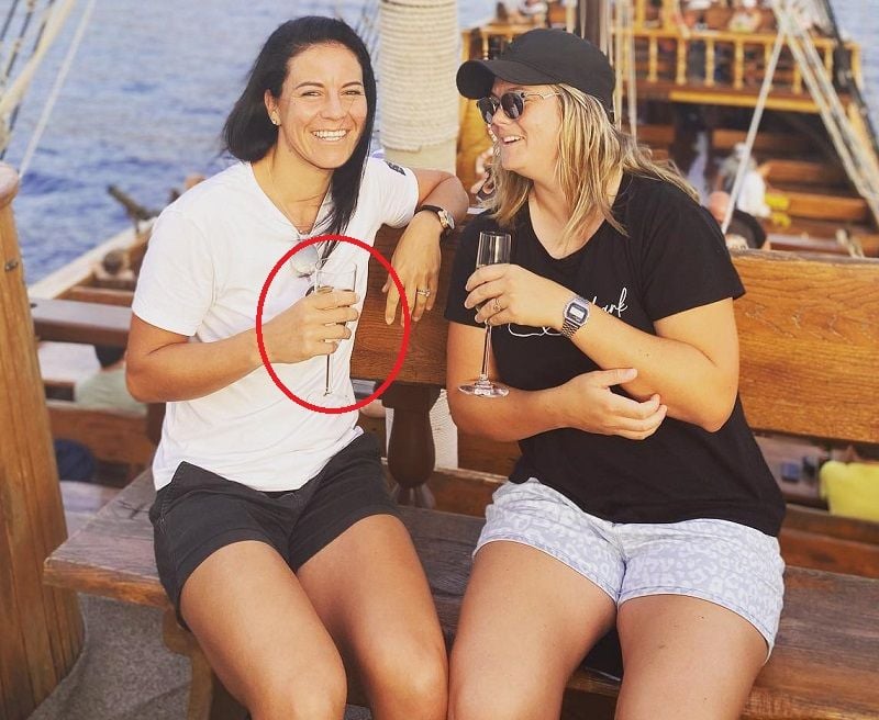 Marizanne Kapp holding a glass of wine