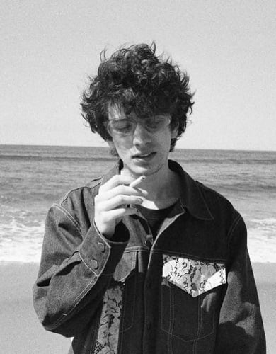 Mark Eydelshteyn smoking a cigarette