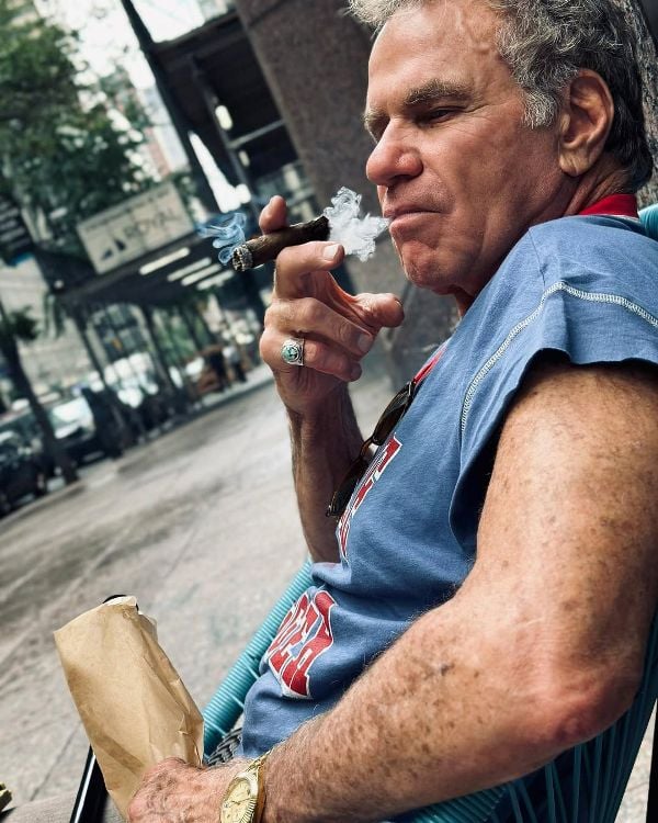 Martin Kove, while smoking a cigar