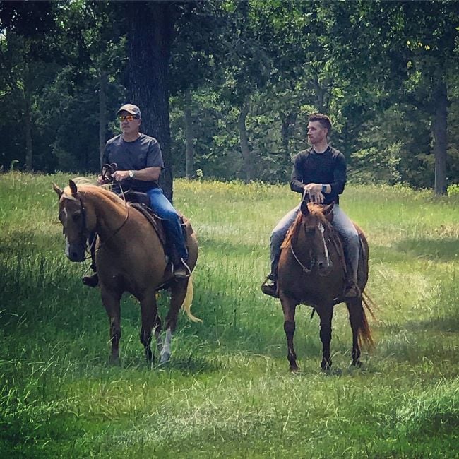 Marty Smith (right) riding a horse