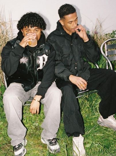 Marvin Opana (right) smoking and drinking whiskey during a party