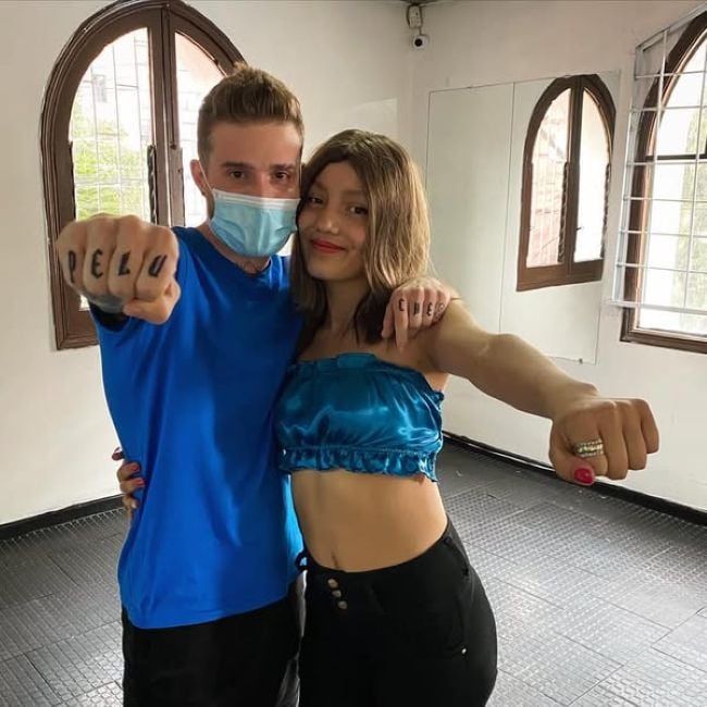 Mateo Varela with the woman to whom he donated his hair