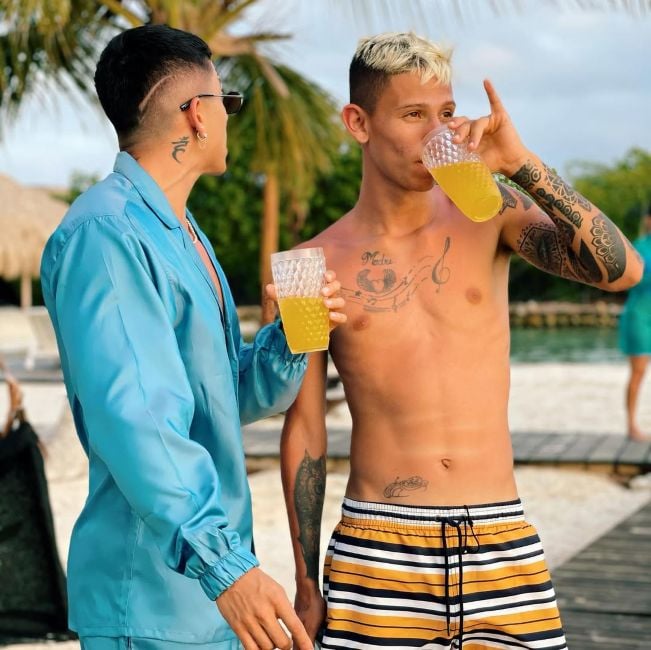 Mauricio Gómez drinking an alcoholic beverage