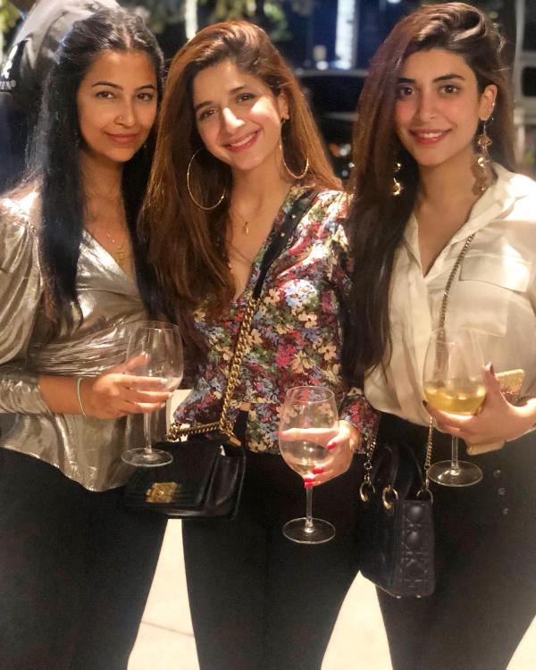 Mawra Hocane (centre) while consuming an alcoholic beverage