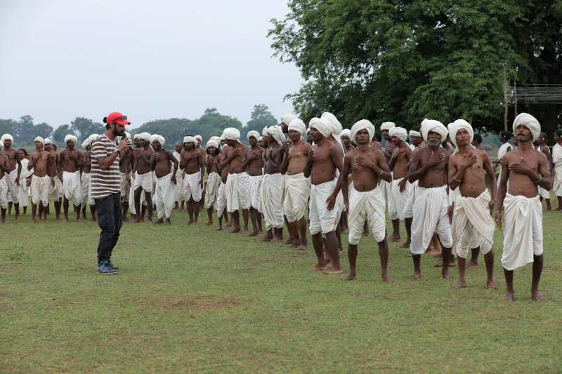 Mayank Dixit with tribal people during the shooting of the film 