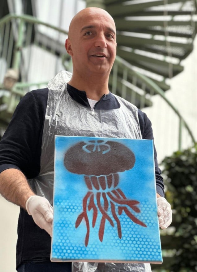 Maziar Mike Doustdar, with a painting he painted