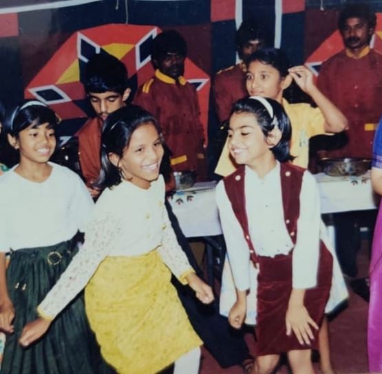 Meenal Sahu (in Maroon dress) at a birthday party in childhood
