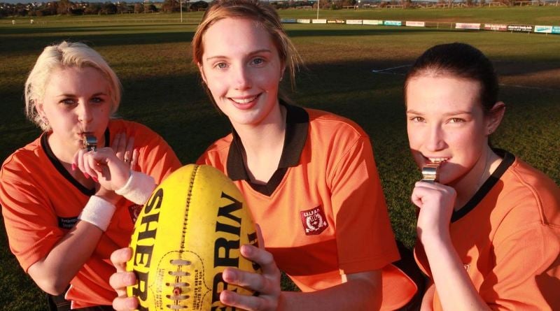 Megan Schutt (right) in her football umpiring days