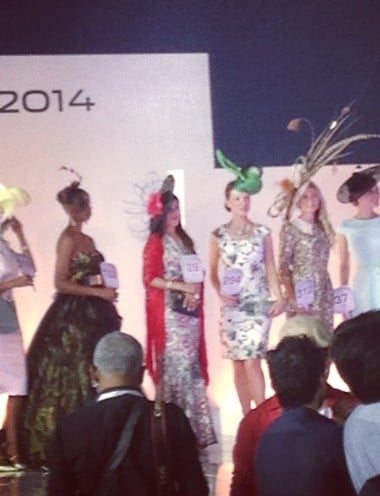 Meghna Lakhani (in red) while walking the ramp at a fashion show in 2014