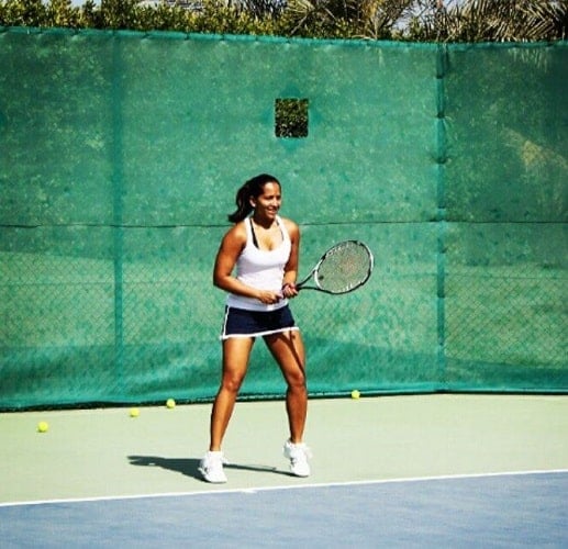 Meghna Naidu playing tennis