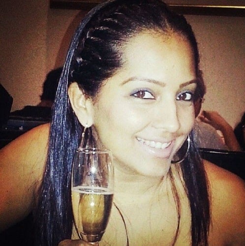 Meghna Naidu with a glass of wine
