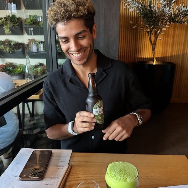 Mena Massoud, while having a beer