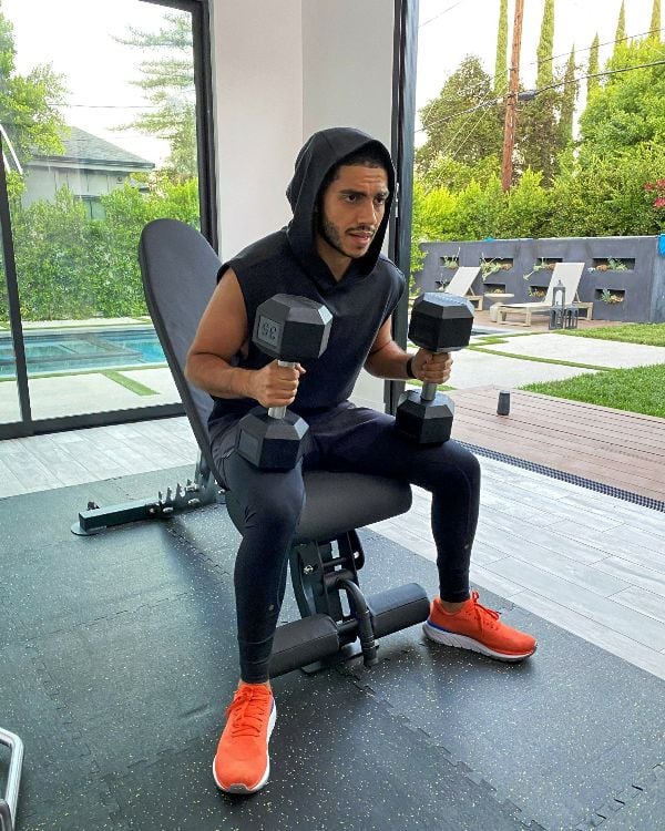 Mena Massoud, while working out at a gym