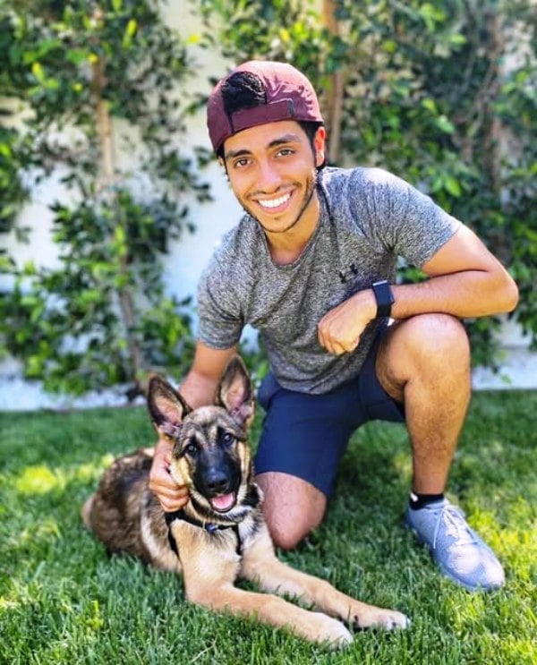 Mena Massoud with his pet