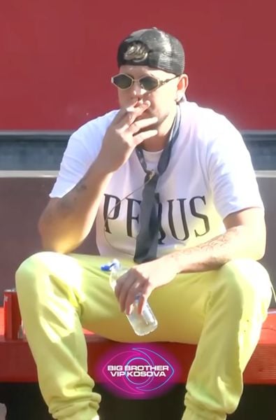 Mevlan Shaba smoking a cigarette