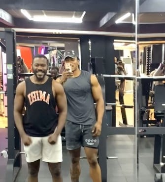 Michael Adeleye posing with film producer Deyemi Okanlawon