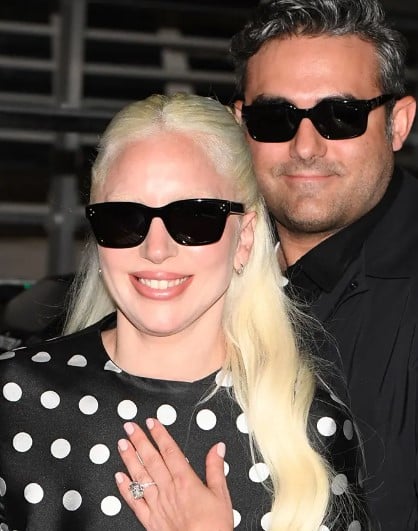 Michael Polansky with Lady Gaga while showing her engagement ring