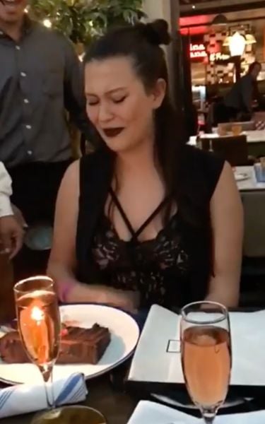 Michelle Carvalho drinking wine at her birthday party