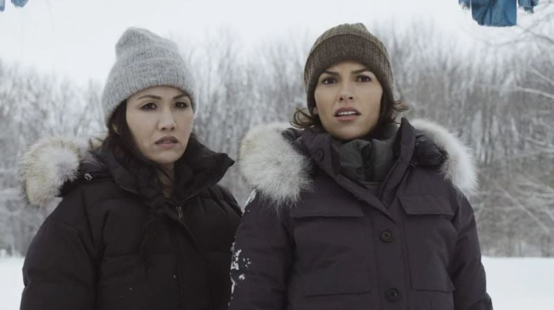 Michelle Lee (left) as Violet and Sofia Pernas as Lexi Vaziri in the American action-adventure TV series Blood &amp; Treasure (2023)