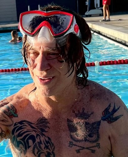 Mickey Rourke swimming