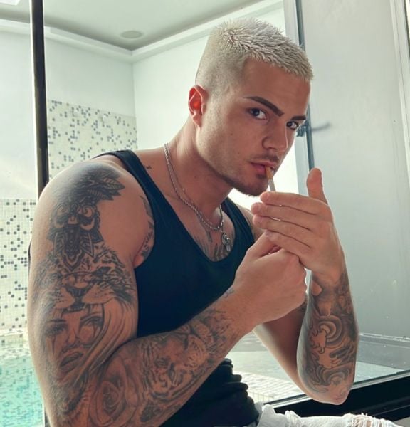 Miguel Martínez smoking a cigarette