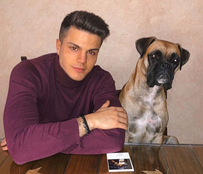 Miguel Martínez with his pet dog