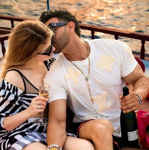 Milena Alexandra holding a glass of alcohol