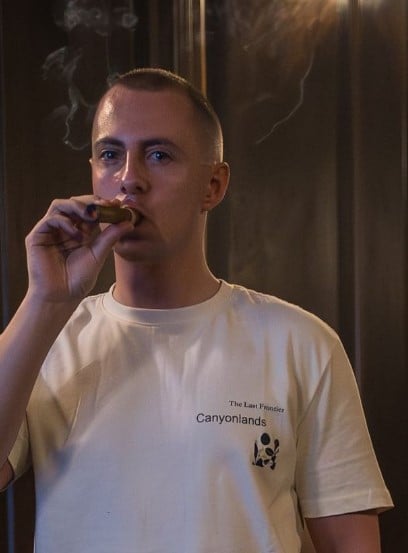 Miles Routledge while smoking a cigar