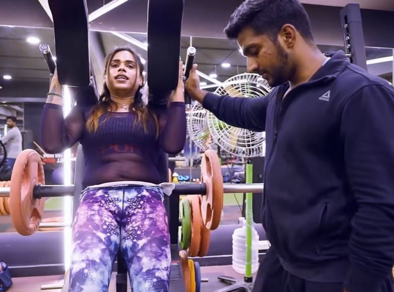 Milla Babygal, along with her trainer, while working out at the gym
