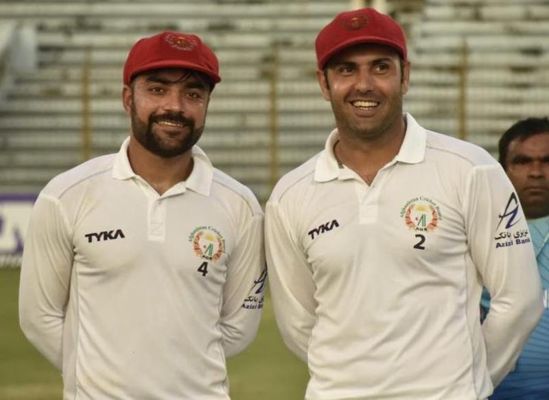 Mohammad Nabi with Rashid Khan (left) during his last test match