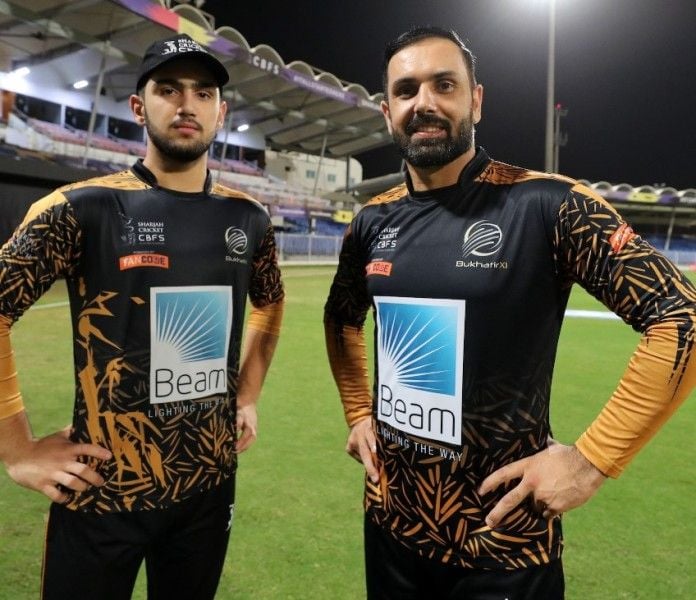 Mohammad Nabi with his son, Hassan Khan, during a cricket match