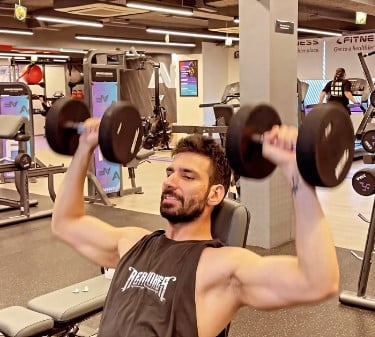 Mohit Chhikara while exercising at a gym
