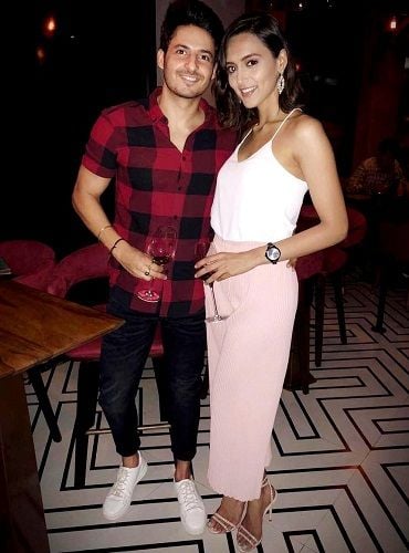 Mohit Malhotra with a glass of wine