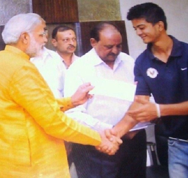 Monank Patel with Narendra Modi (left) when he played for age group teams in Gujarat
