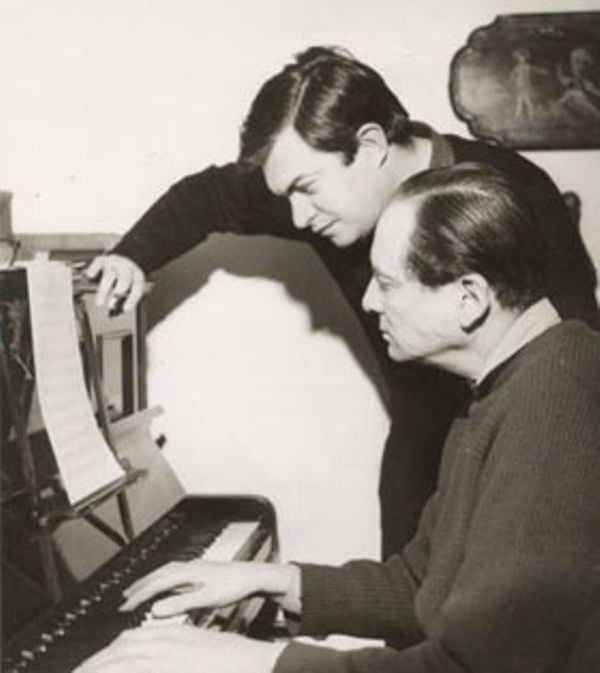 Monty Norman explaining a song written by him to the producers