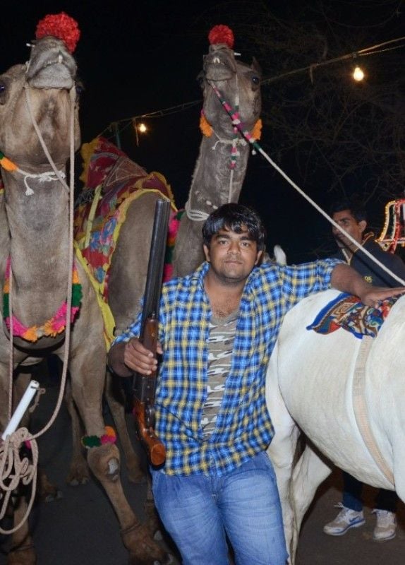 Monu Manesar holding a rifle