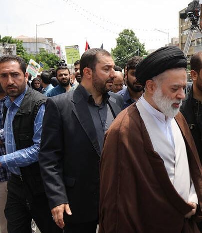 Mostafa Khamenei (in brown) during a rally