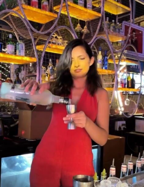 Mrunal Shankar making herself a drink