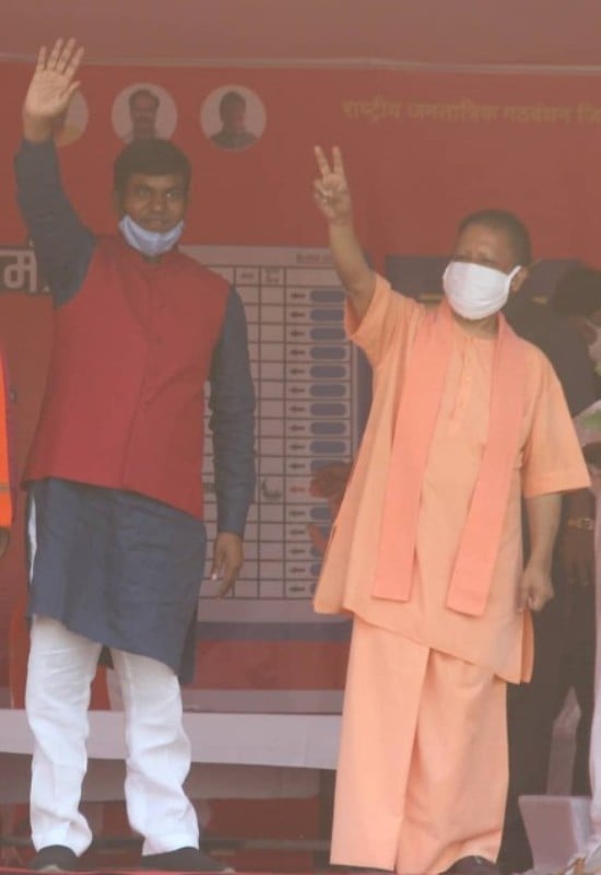 Mukesh Sahani with Yogi Adityanath (right)