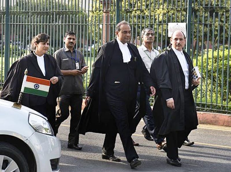 Mukul Rohatgi with his retinue coming out of the Supreme Court of India