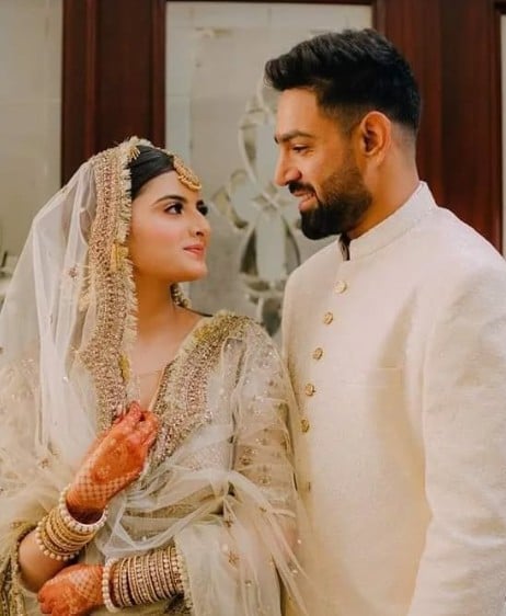 Muzna Massod Malik with her husband on their wedding day