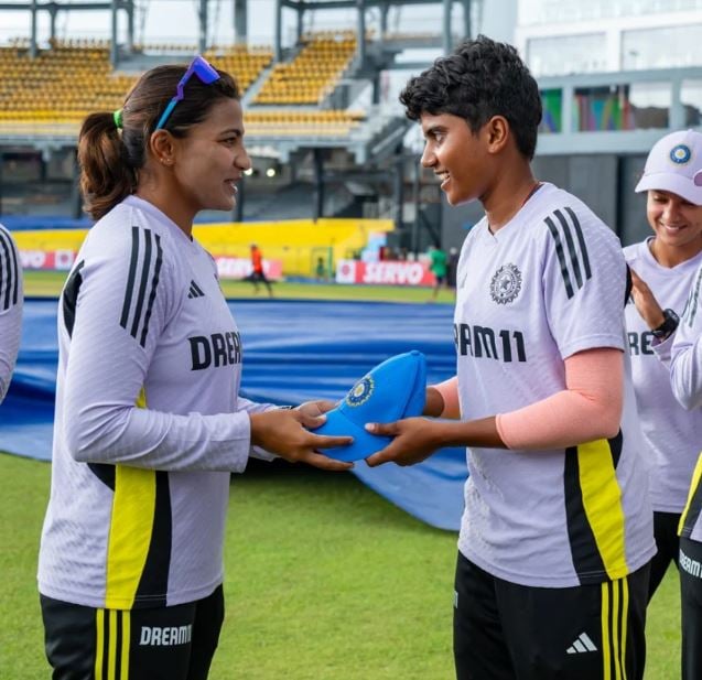N Sree Charani getting Indian cap from Sneh Rana on her ODI debut
