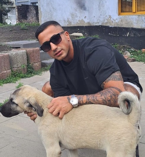 Nadiem Bahiat posing with his pet