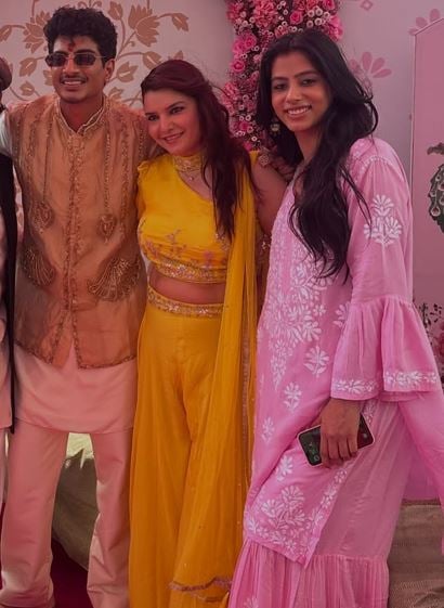 Nandika Dwivedi (in pink) with Palash Muchhal before their wedding