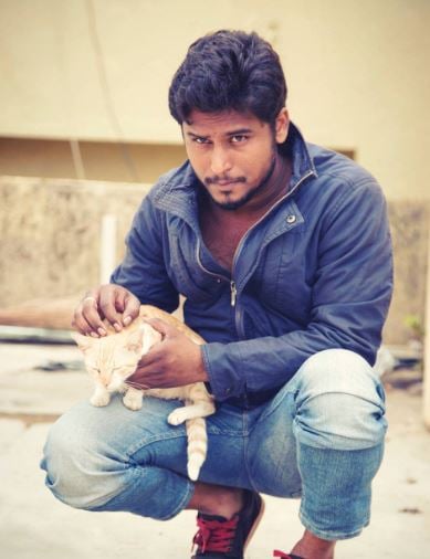 Naveen Shankar with a cat