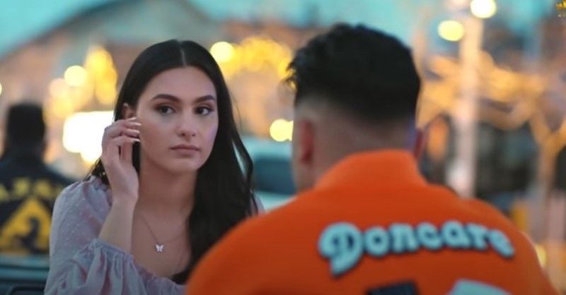 Navi Brar (left) in a still from the music video 