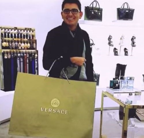 Navid Sole shopping at a Versace store