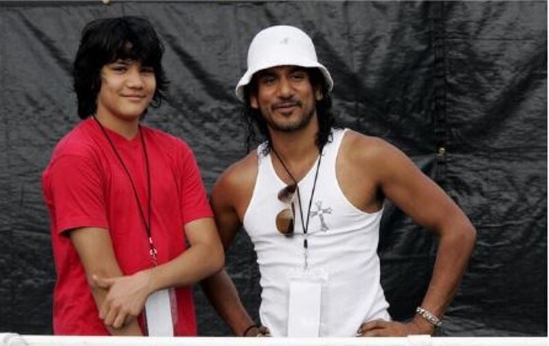 Naveen Andrews with his son at a Football game
