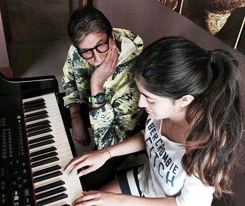Navya Naveli Nanda while playing piano as AmitabhNavya Naveli Nanda while playing piano as Amitabh looking at her looking at her
