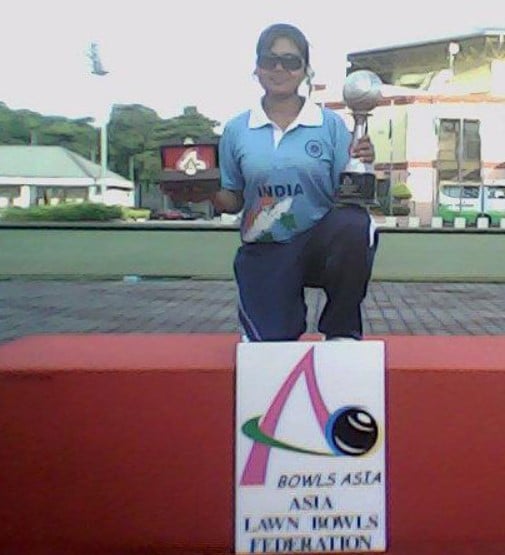 Nayanmoni Saikia after winning a trophy in Lawn Bowls in 2012